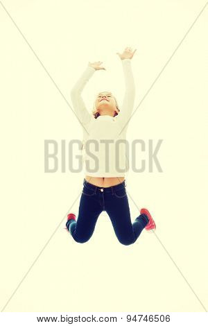 Little pretty girl jumping with joy