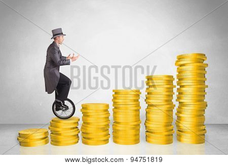 Business man riding monocycle up on coin graph concept on background