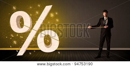Business man pulling rope with big procent symbol sign concept on background