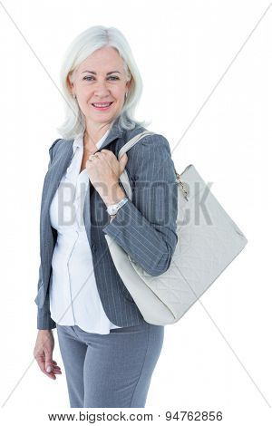 Businesswoman with bag against white background