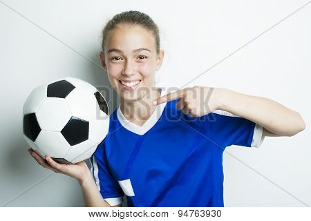 girl in sport wear with football isolated on white background