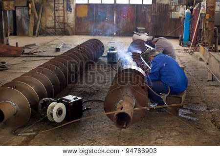 Welders Reparing Ship Parts