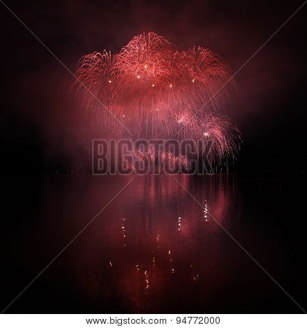 Colorful Fireworks With Reflection On Lake.