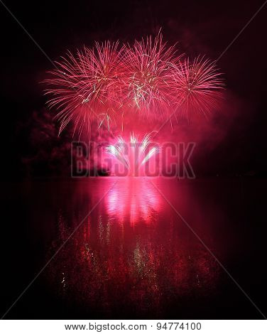 Colorful Fireworks With Reflection On Lake.