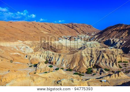  Picturesque multicolored sandstone dry talus. Ancient mountains in the valley of the Dead Sea