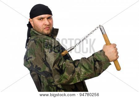 Young man in soldier uniform holding nunchaks isolated on white
