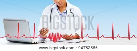 healthcare, medical diagnosis and technology concept - african female doctor with laptop pc computer looking at medical report over blue background with red heart shape and cardiogram