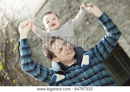 Young dad with her baby boy