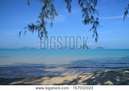 Beautiful white sand and blue sea of Thailand with many islands, view from Tub Kaek beach, Krabi.