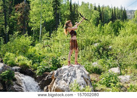 Young Beautiful Amazon Girl Hunting In The Forest