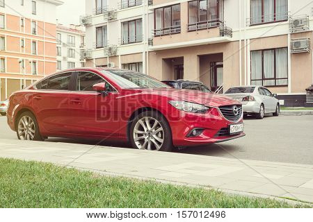 Sochi, Russia - October 11, 2016: New red Mazda 6 (Atenza) parked on the street of Sochi. The Mazda 6 has sold over one million units worldwide since its introduction hitting this sales milestone faster than all previous Mazdas.