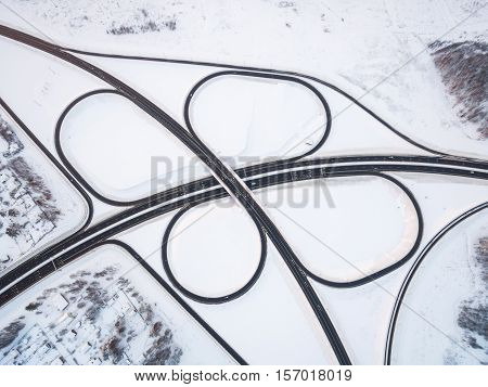 winter road junction in the countryside aerial view  in the form of butterfly