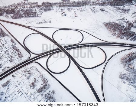 winter road junction in the countryside aerial view  in the form of butterfly