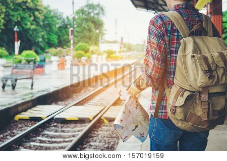 Young Tourist With A Beard Holding A Map Travel Concept