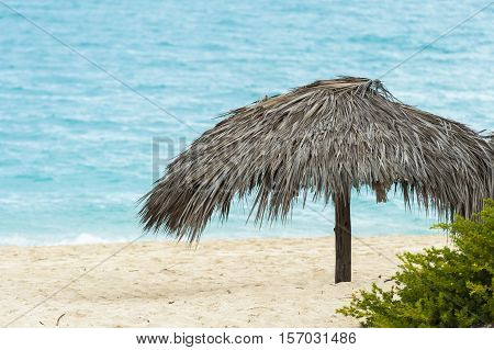 Beach hut by the caribbean sea in Cuba