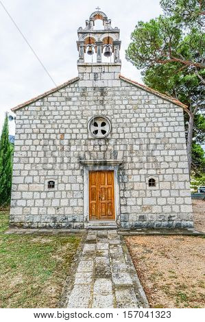 Virgin Mary church on graveyard in Tucepi, Croatia.