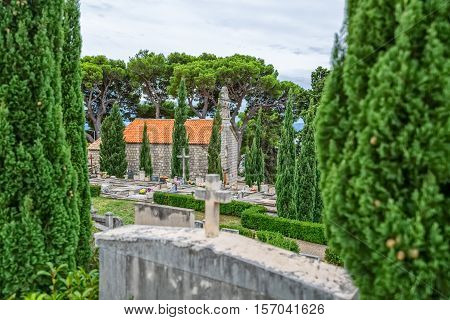 Virgin Mary church on graveyard in Tucepi, Croatia.