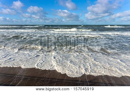 the waves of the sea Sunny day, beautiful clouds