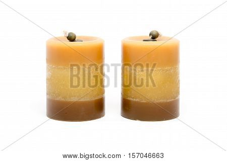 Pair of orange wax candle isolated on white background