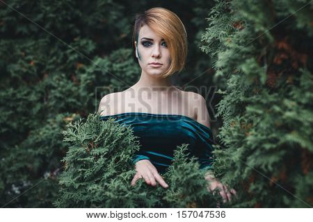 Portrait of a beautiful girl in the forest.