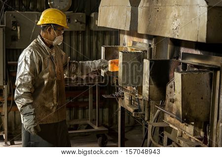 Siberia, Russia - NOVEMBER 14, 2016: moulting gold at a factory