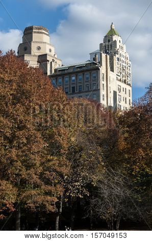 Autumn Colored Trees With Buildings Behind Them