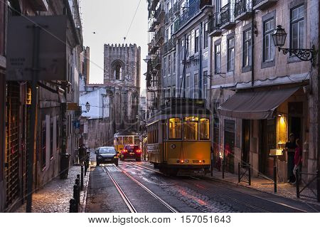 Tram car driving at night in Lisbon, Portugal