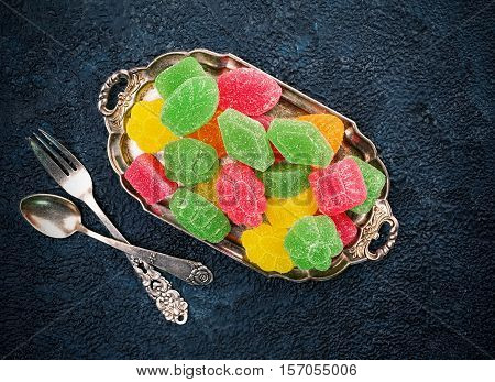 Set fruit marmalade on a tray and textured surface top view