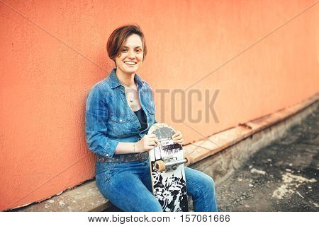 Fashion and urban lifestyle beautiful young woman with longboard isolated. Soft effect and instagram filter