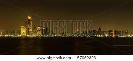 Night Panorama of Abu Dhabi at night capital of United Arab Emirates. Abu Dhabi skyline - United Arab Emirates