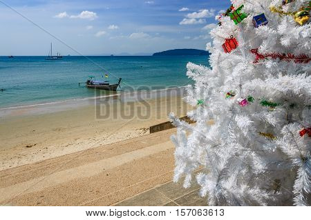 Ao Nang beach, Thailand - December 25 2012: Christmas tree in front of Ao Nang beach on Christmas Day in Krabi Province, southern Thailand