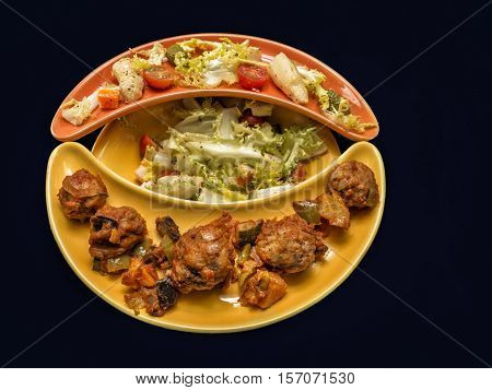 Meatball and salad . Healthy food on original plate