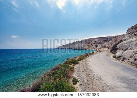 Cretan road along the coast of Crete island with beautiful lagoon and mountains