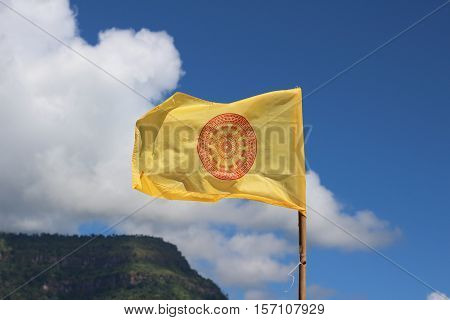Thammachak symbol on the flag, Flag of Buddhism on sky