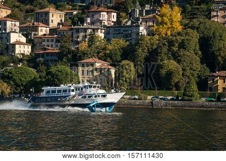 Hydrofoil floats on the lake along the shore on Como lake. Seen near Como town 7 November 2016.