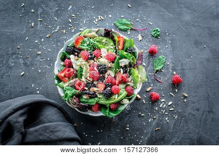 summer salad with chicken letuce veggies and mixed fruit