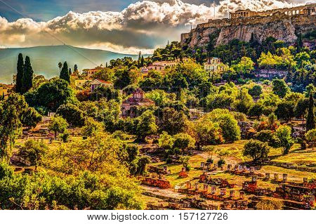 View on Acropolis from ancient agora, Athens, Greece. Beautiful landscape photography at dawn with ruins of classical greek architecture.