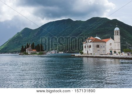 Our Lady Of The Rocks and Saint George islets near Perast on Kotor Bay. Saint George Benedictian monastery and Roman Catholic Church of Our Lady Of the Rocks are situated on the islands.