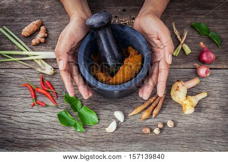 The Women Hold Pestle With Mortar And Spice Paste . Red Paste Ingredients For Red Curry On Rustic Wo