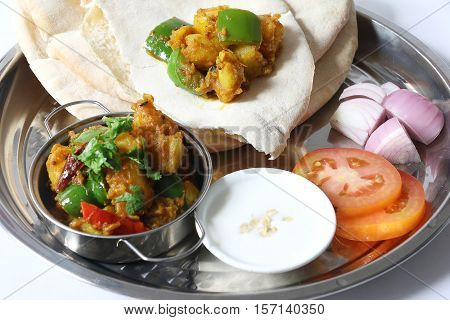 Potato curry aloo with indian roti / chapati / fulka / paratha / pita / naan / indian bread, indian spicy food