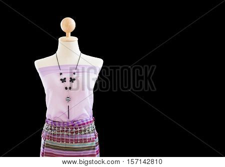 A half length of Thai traditional dresses on mannequin with black background, identity culture of Thailand