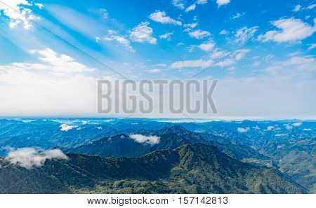 clouds float over the mountains, beautiful sunbeam