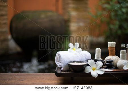 Spa massage compress balls herbal ball on the wooden with treaments spa Thailand select focus