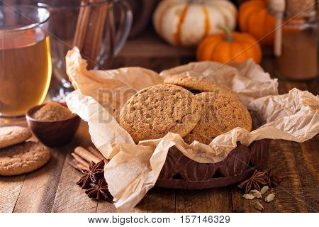 Pumpkin cinnamon snickerdoodle cookies with tea in rustic setting