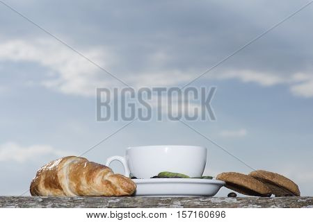 Cup Of Coffee Or Tea With Croissant