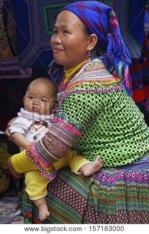Coc Ly, Vietnam, October 25, 2016 : Baby And His Mother During Tuesday Market Of Coc Ly, A Small Vil