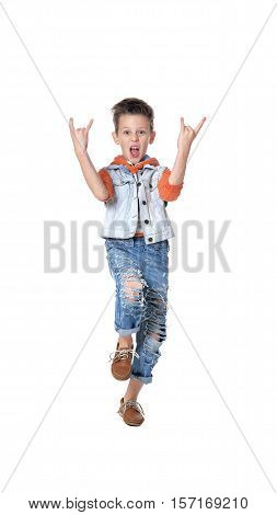 Full length portrait of happy  little boy showing rock gesture isolated on white background