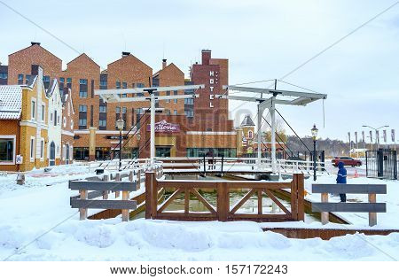 KIEV UKRAINE - NOVEMBER 11 2016: The shopping city built in Dutch Revival Style with canals wooden drawbridge and brick buildings on November 11 in Kiev.