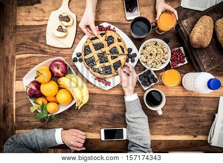 Couple having breakfast. View from above with food and drinks