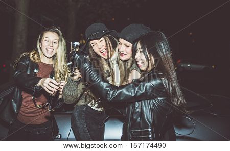 Four girls making party outdoor in the night